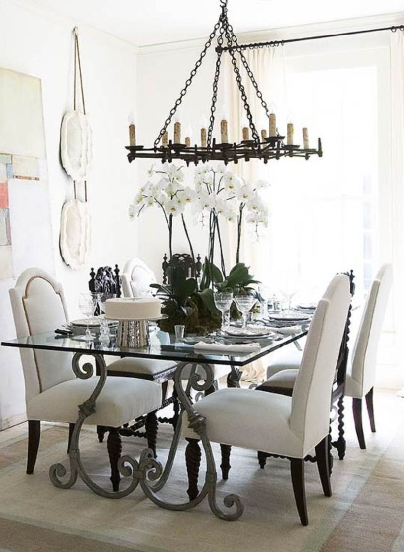 An ornate wrought iron table is the focal point of