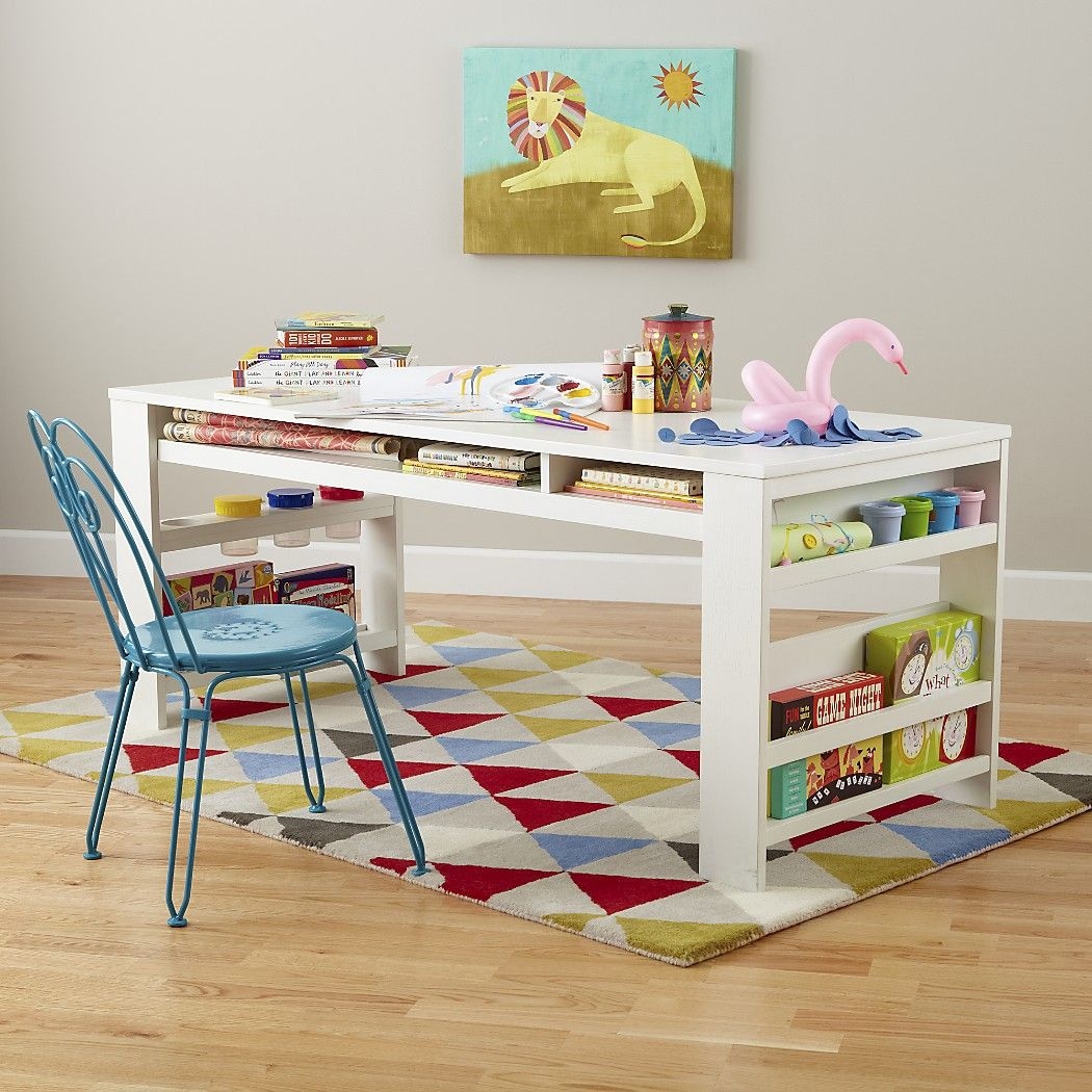 kids activity table with bookshelves