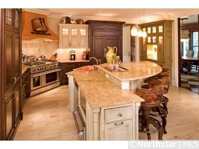 Rustic kitchen island with sink and bar