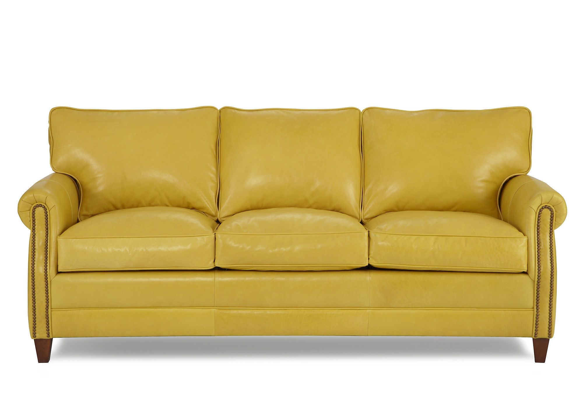 yellow walls brown leather sofa