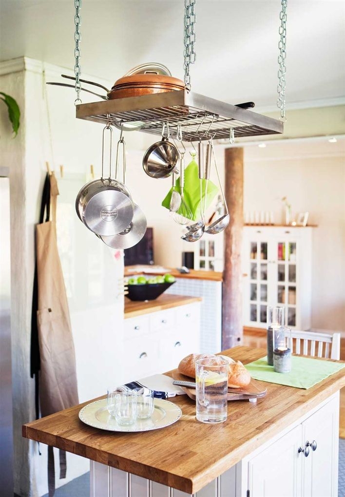 Kitchen Island with Metal Tray of Flowers, Containers and Bowls