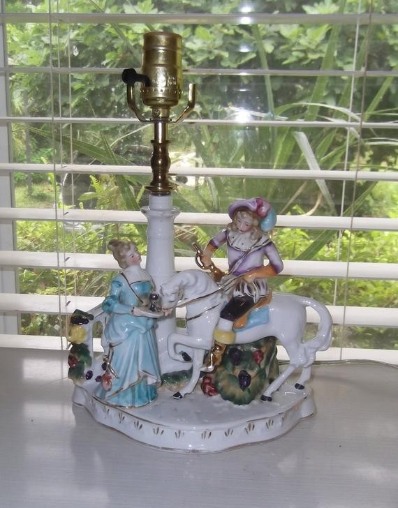 This beautiful vintage porcelain lamp was made in germany it
