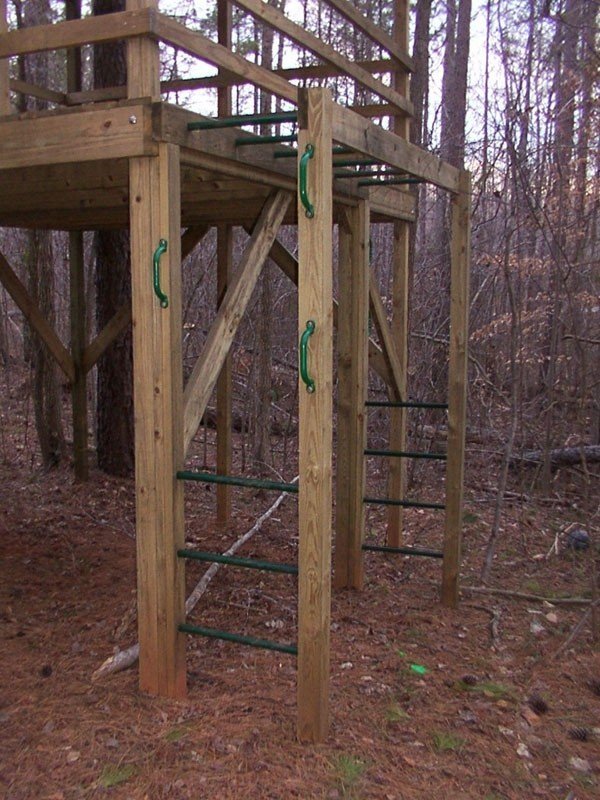 Wood rung monkey bars attatched to 2002 treehouse
