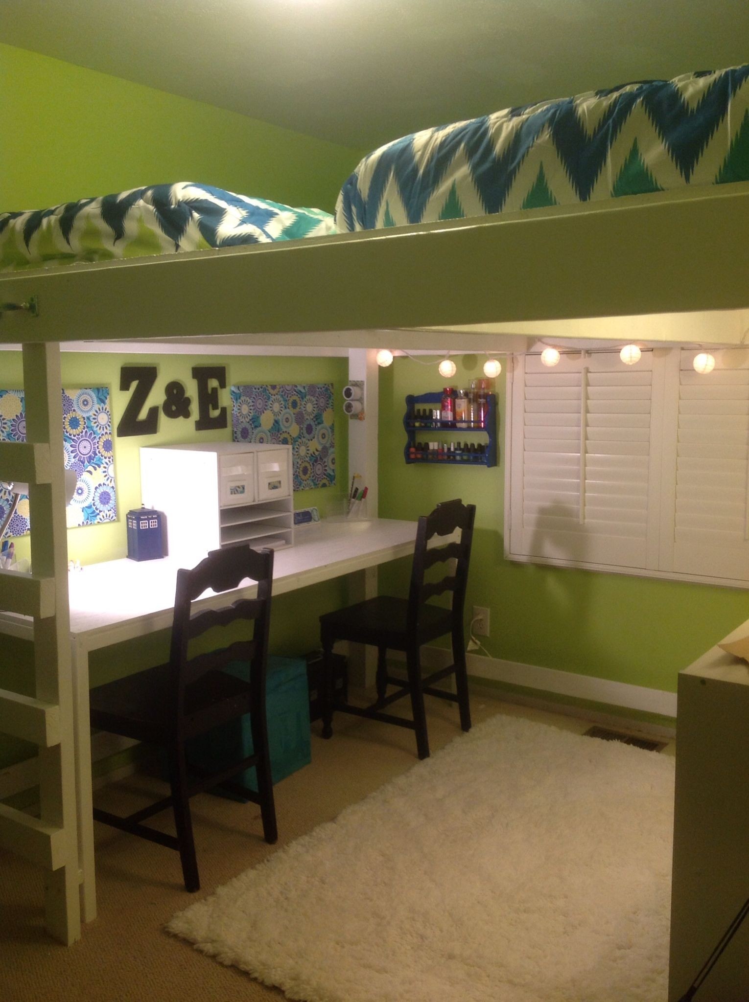 two bunk beds with desk