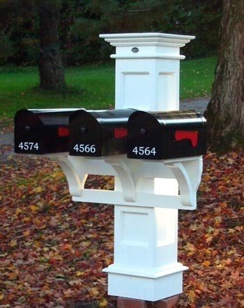 This unique style of multiple mailboxes on one post provides