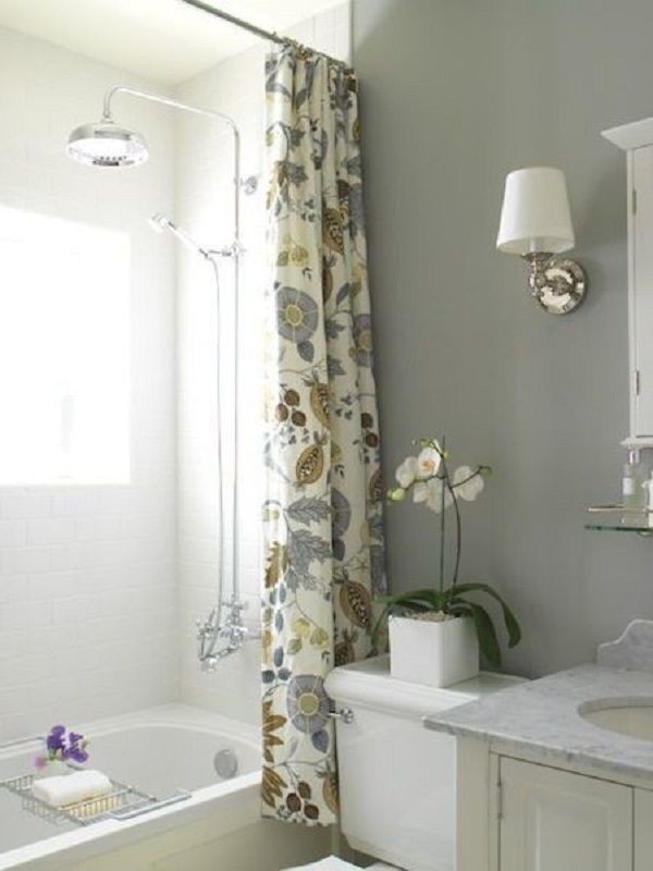 Contemporary gray bathroom with an extra long shower curtain hung