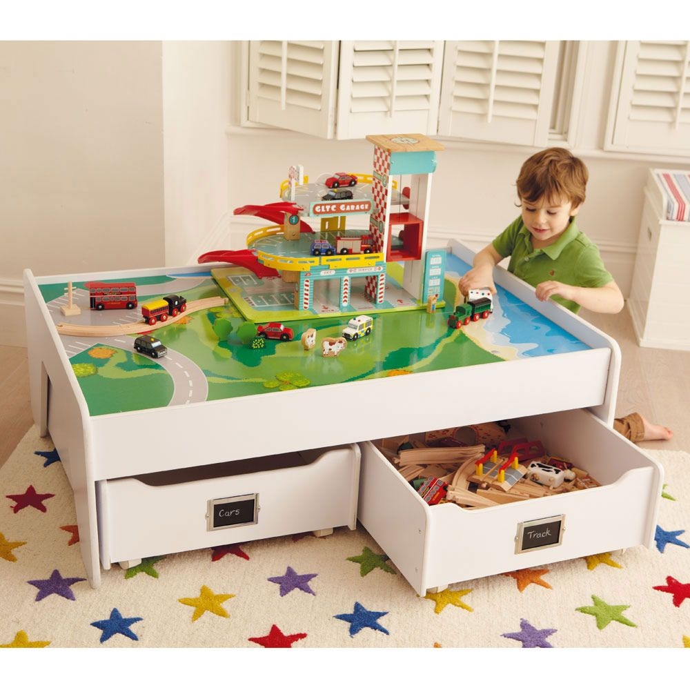 Multipurpose play table features a reversible play surface with plain