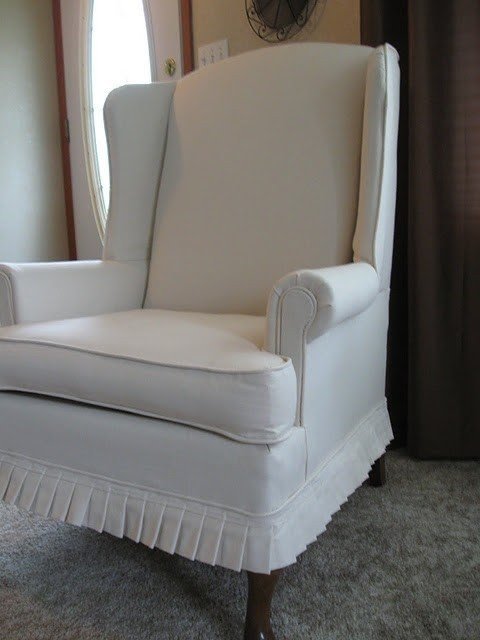 Slipcovered wingback chair 28