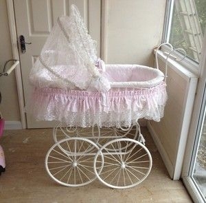 white wicker baby carriage