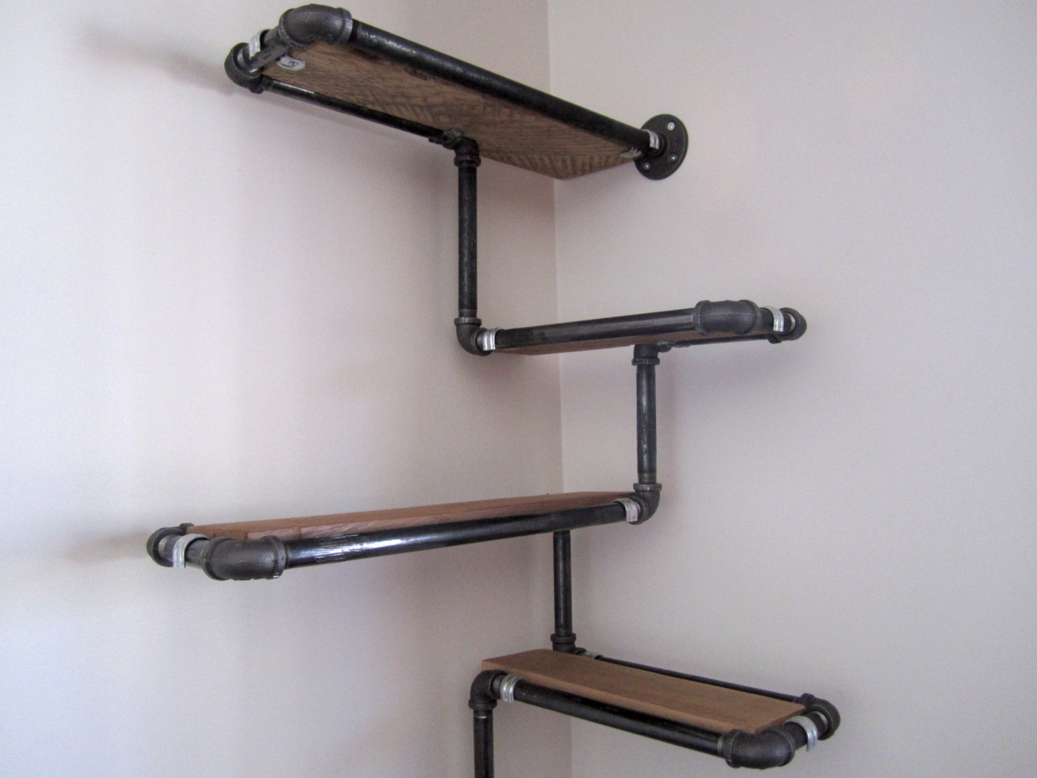 Pipe and reclaimed wood wall shelf