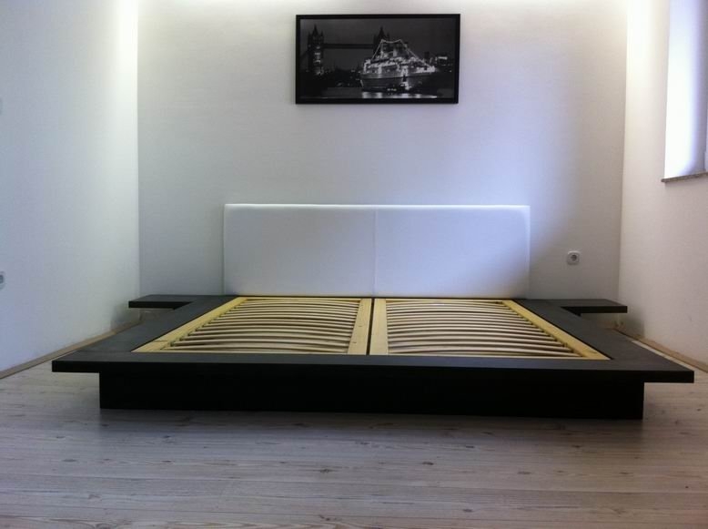 Simple rectangular bed with echoes of japanese decor