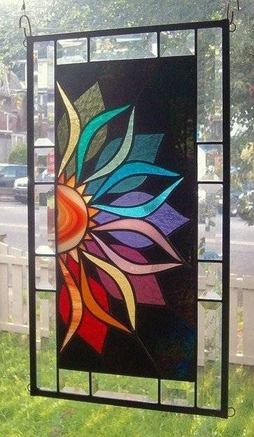 With vivid intensity stained glass window panel signed and dated