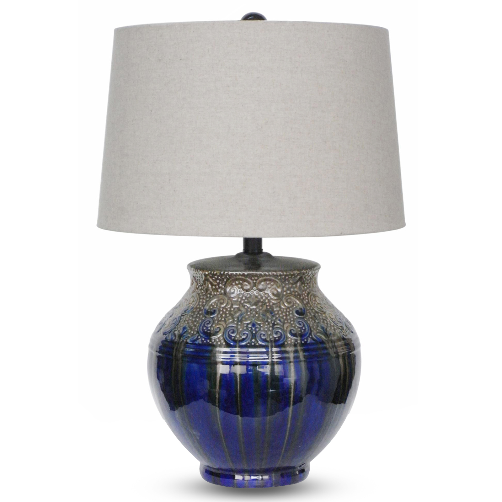 Ceramic table lamp with textured scrolling details and a metallic