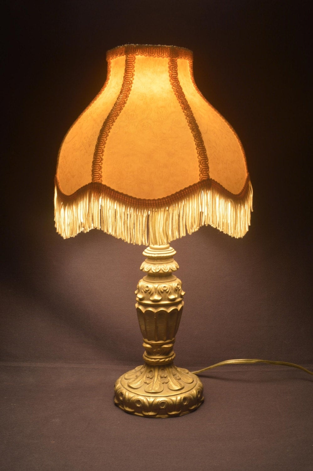 Antique cast metal table lamp