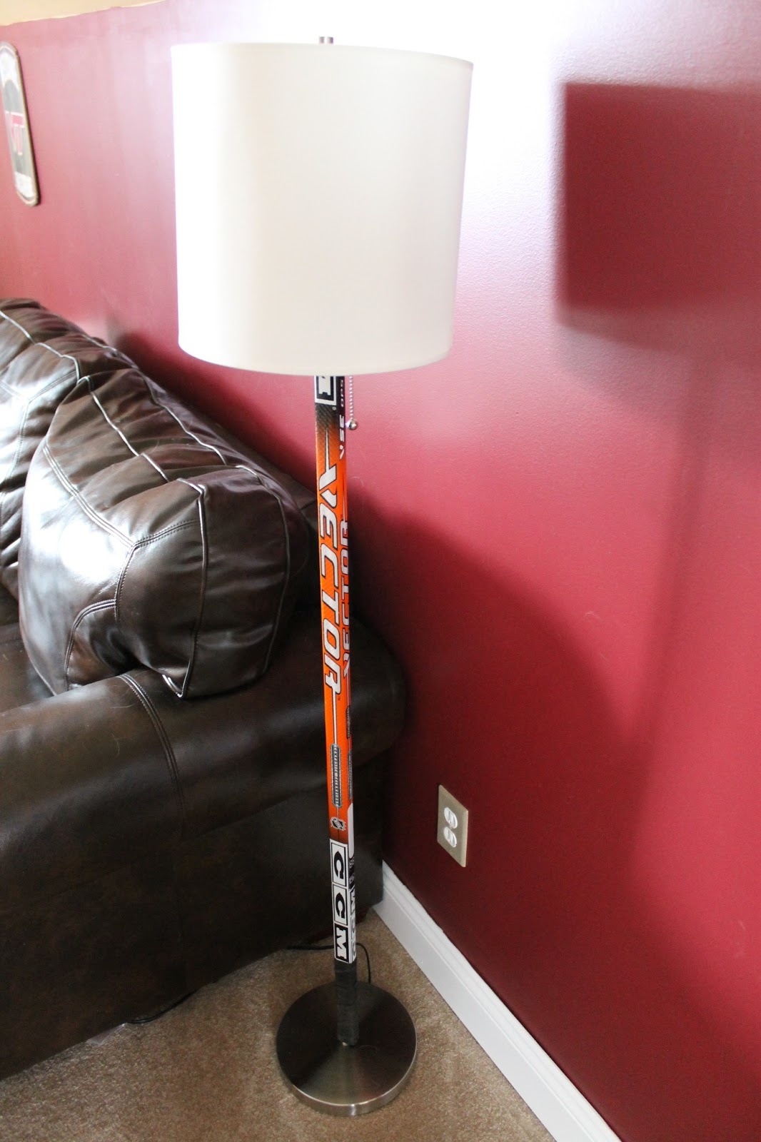 Paint speckled pawprints hockey stick floor lamp 1