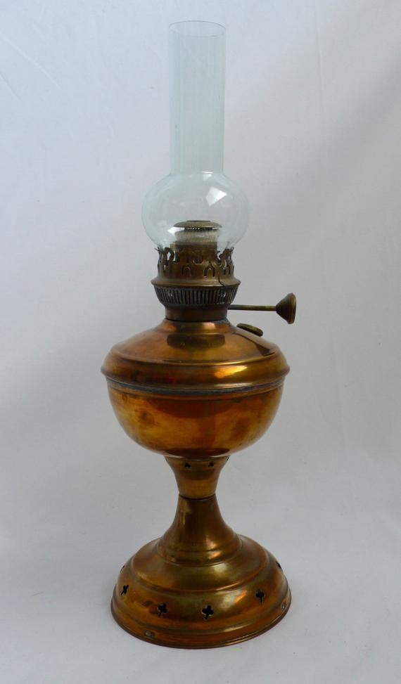 Two vintage gold toned metal oil kerosene lampslanterns  finger lamp tall lamp