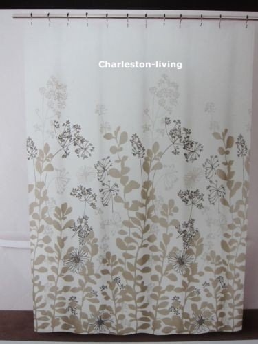 tan and white shower curtain