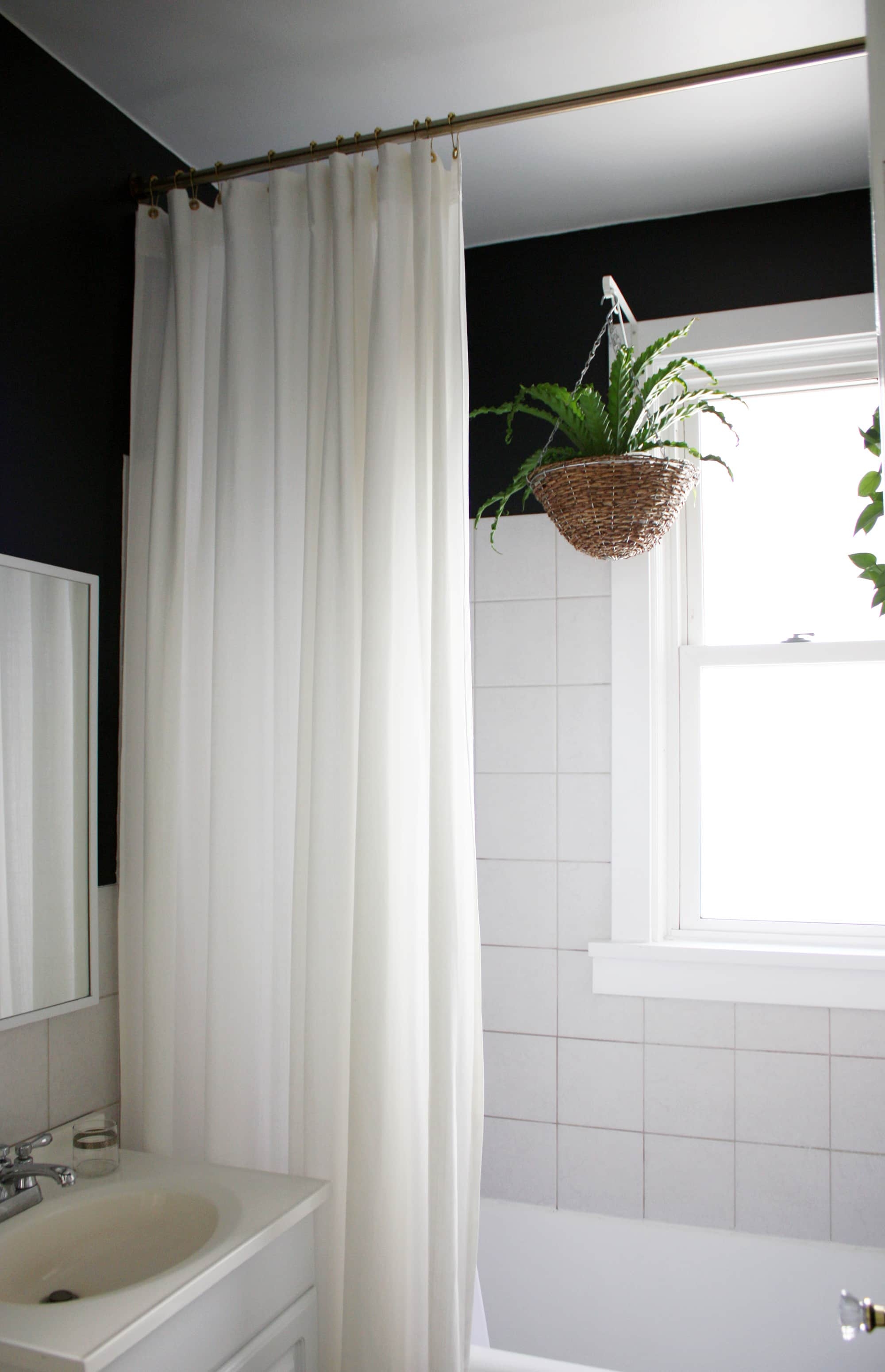 bathtub with shower curtain