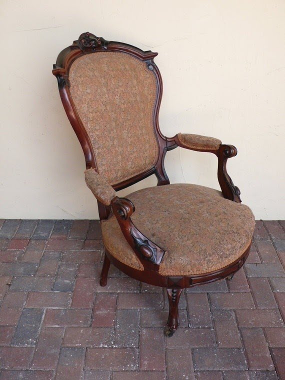 Very rare antique parlor chair with wood frame shown by