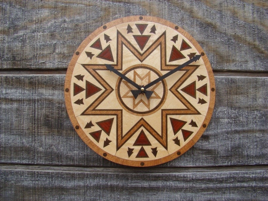 The meeting place wall clock a native american design