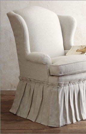 Gorgeous slipcover with button pleated skirt on wingback chair