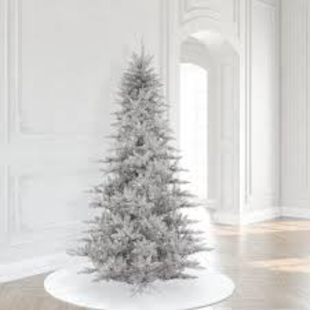 Dazzle holiday guests with an elegant Christmas tree draped with