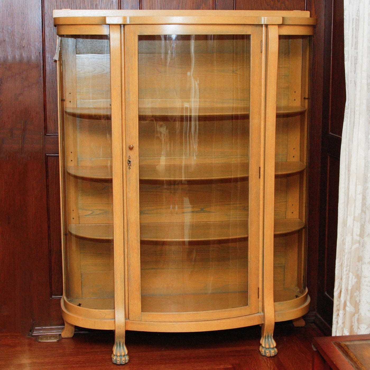 Antique bow front curio cabinet