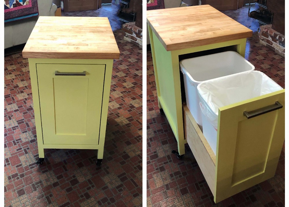 Small kitchen island with slide out double trash cans