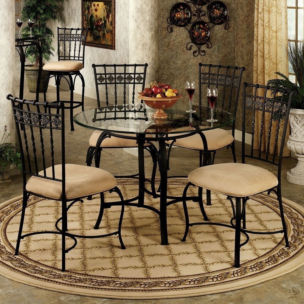 Small wrought iron kitchen table with rounded glass top