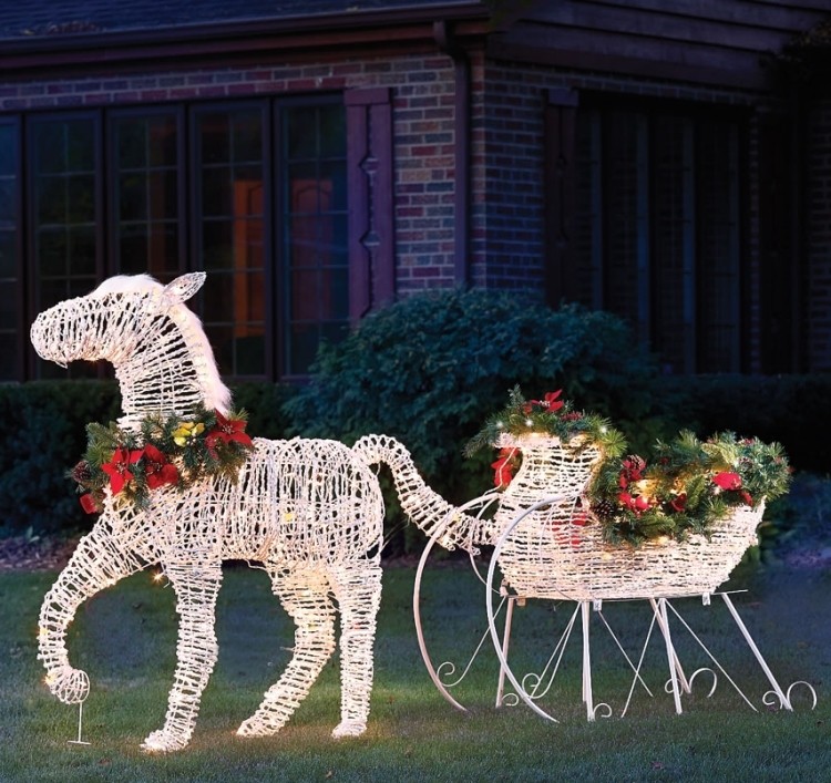 The lighted holiday horse drawn sleigh christmas