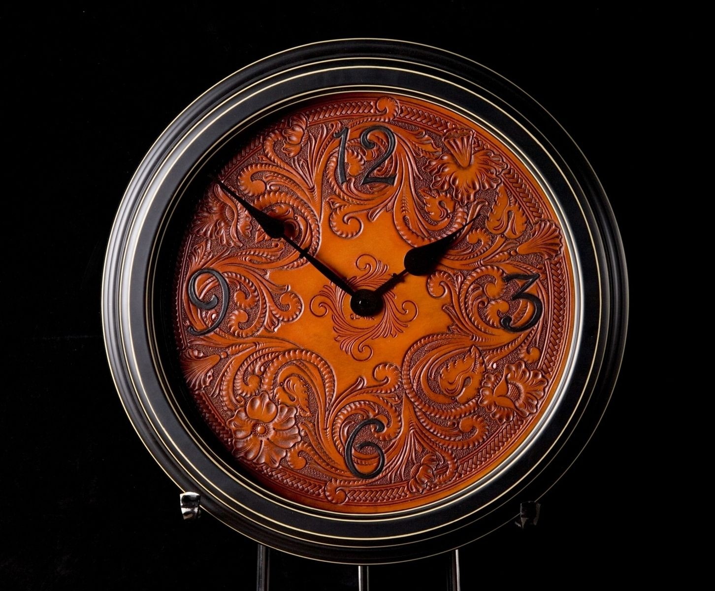 Custom made carved leather wall clock by clair kehrberg