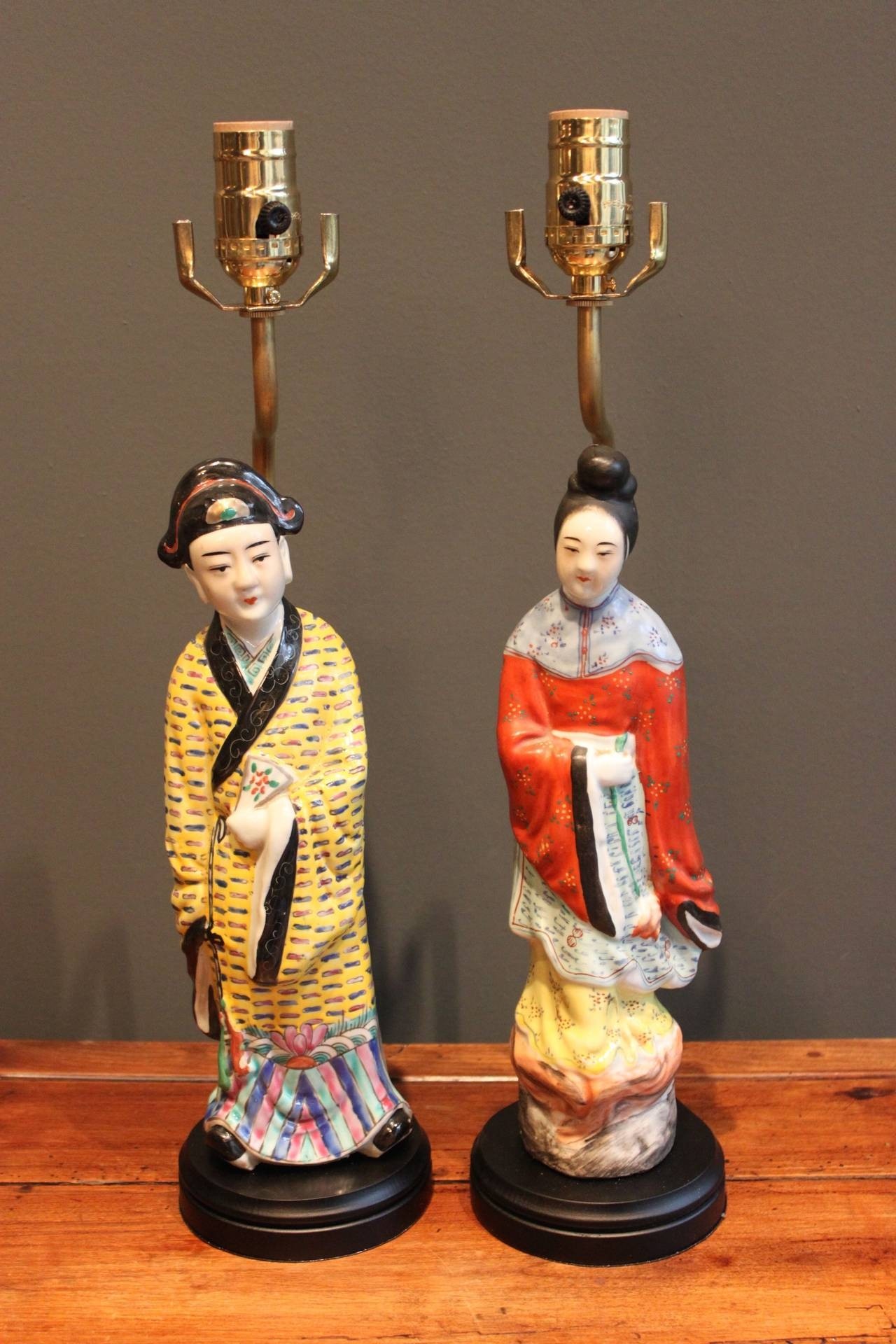 Pair of porcelain lamps of male and female chinese figures