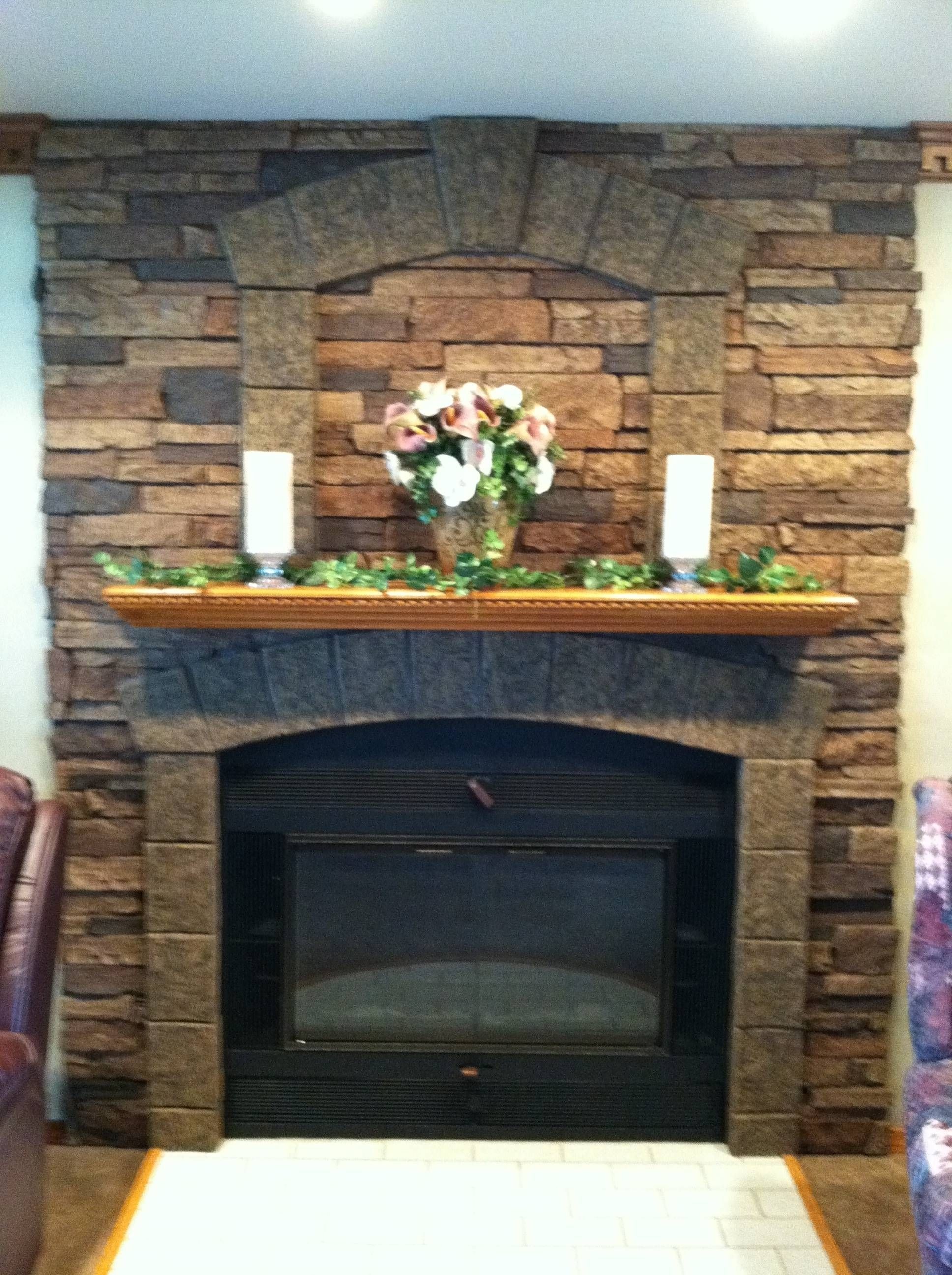 Faux stone wall panels for fireplace design wiith brown