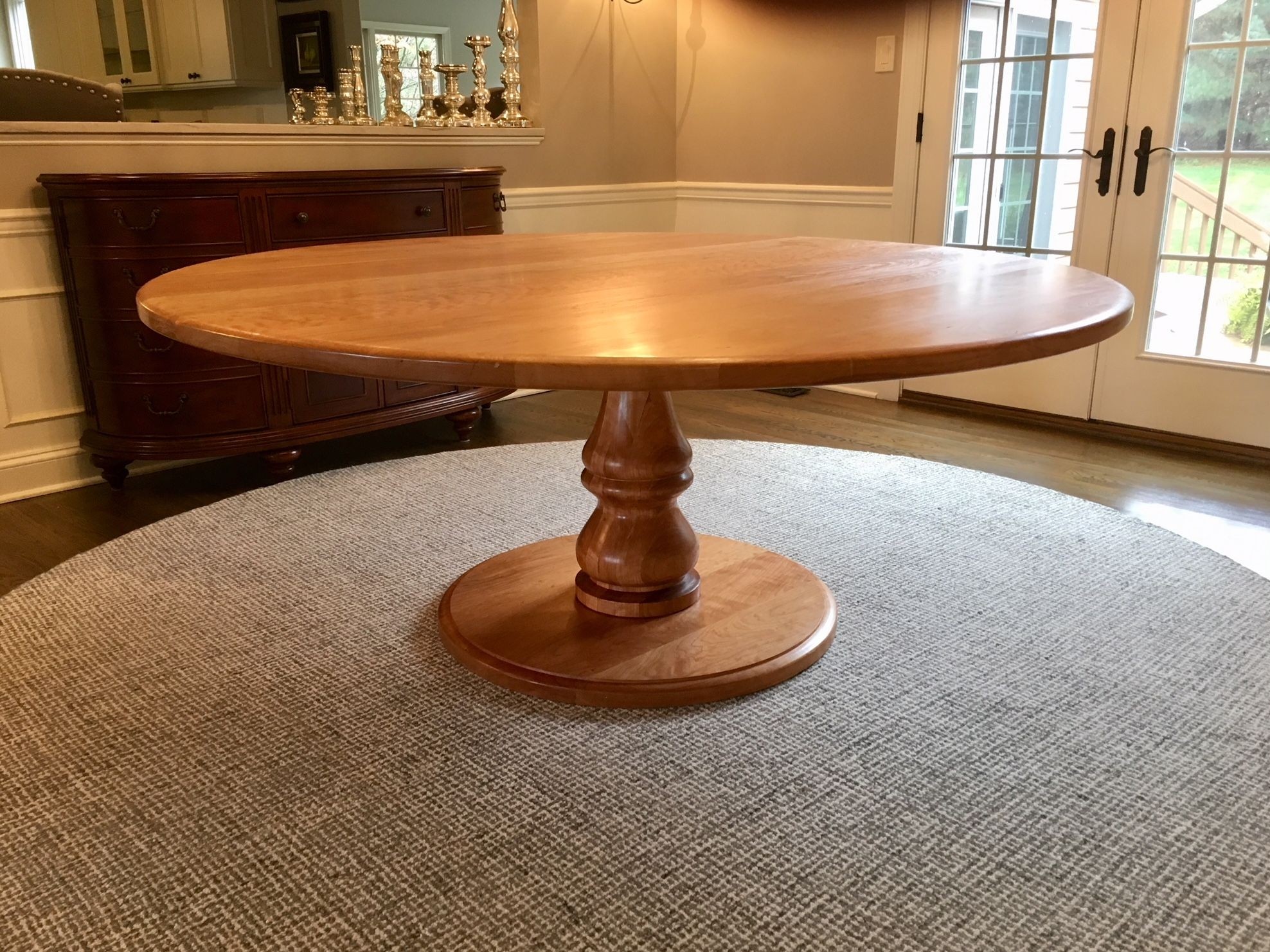 Hand crafted large round pedestal dining table with turned
