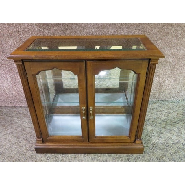 1970s traditional lighted two door curio console cabinet