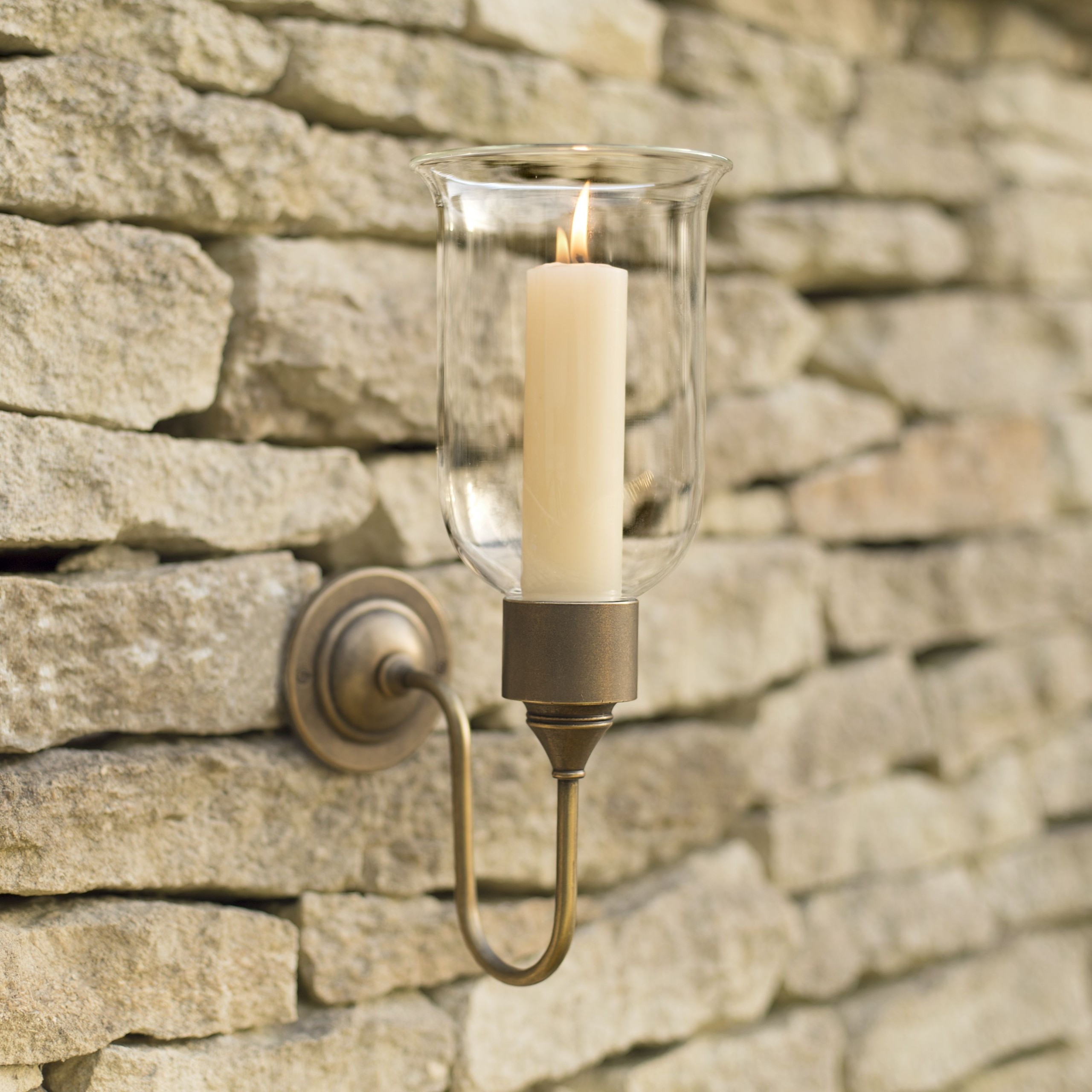 Hurricane candle sconce in antiqued brass candle wall