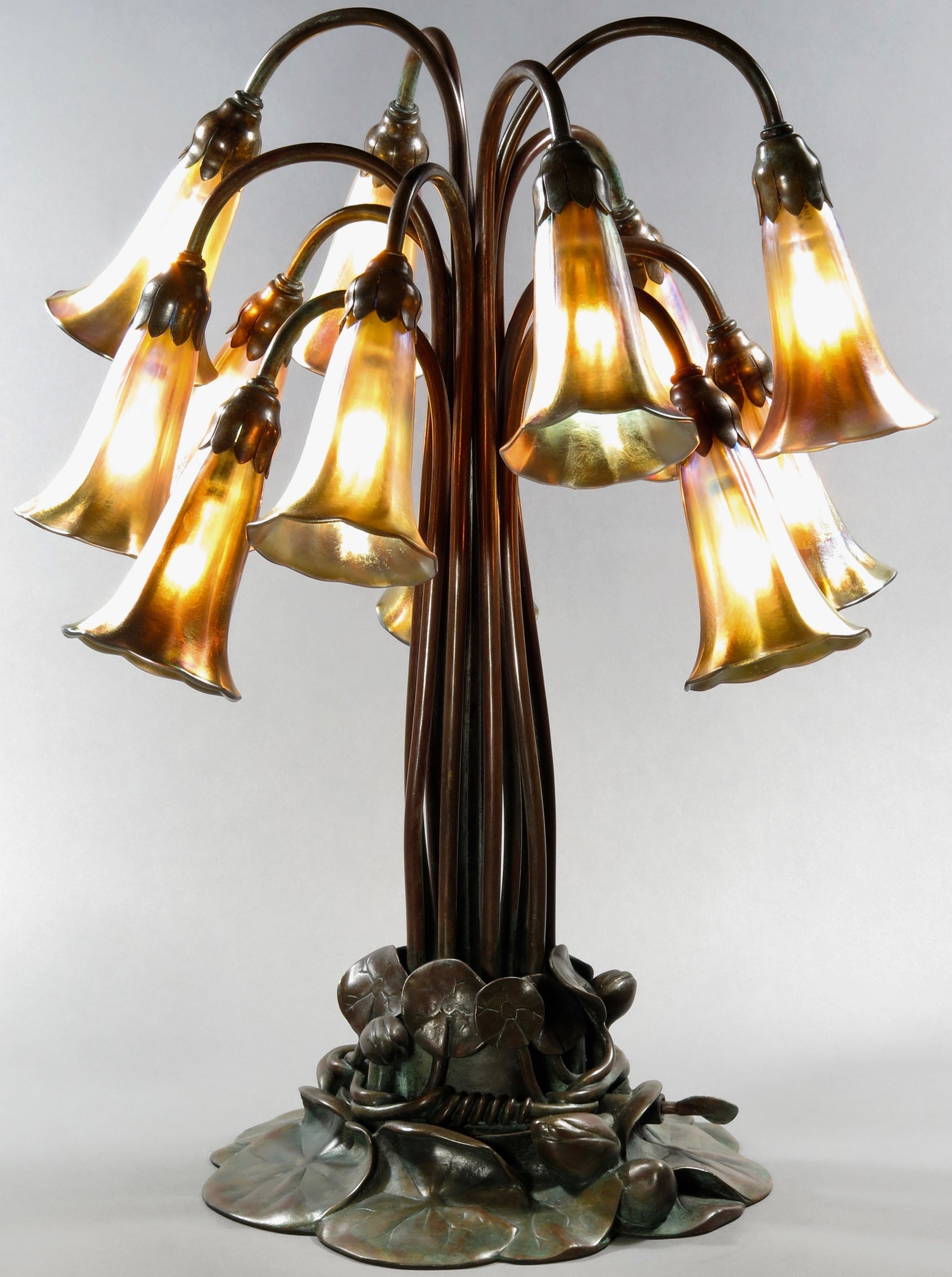 Tiffany studios patinated 12 light lily table lamp