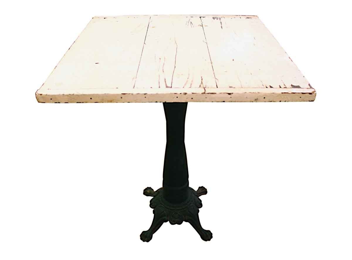 Antique pedestal table with cast iron claw foot base