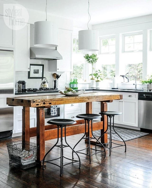 Bright kitchen with dark wooden floors and a reclaimed