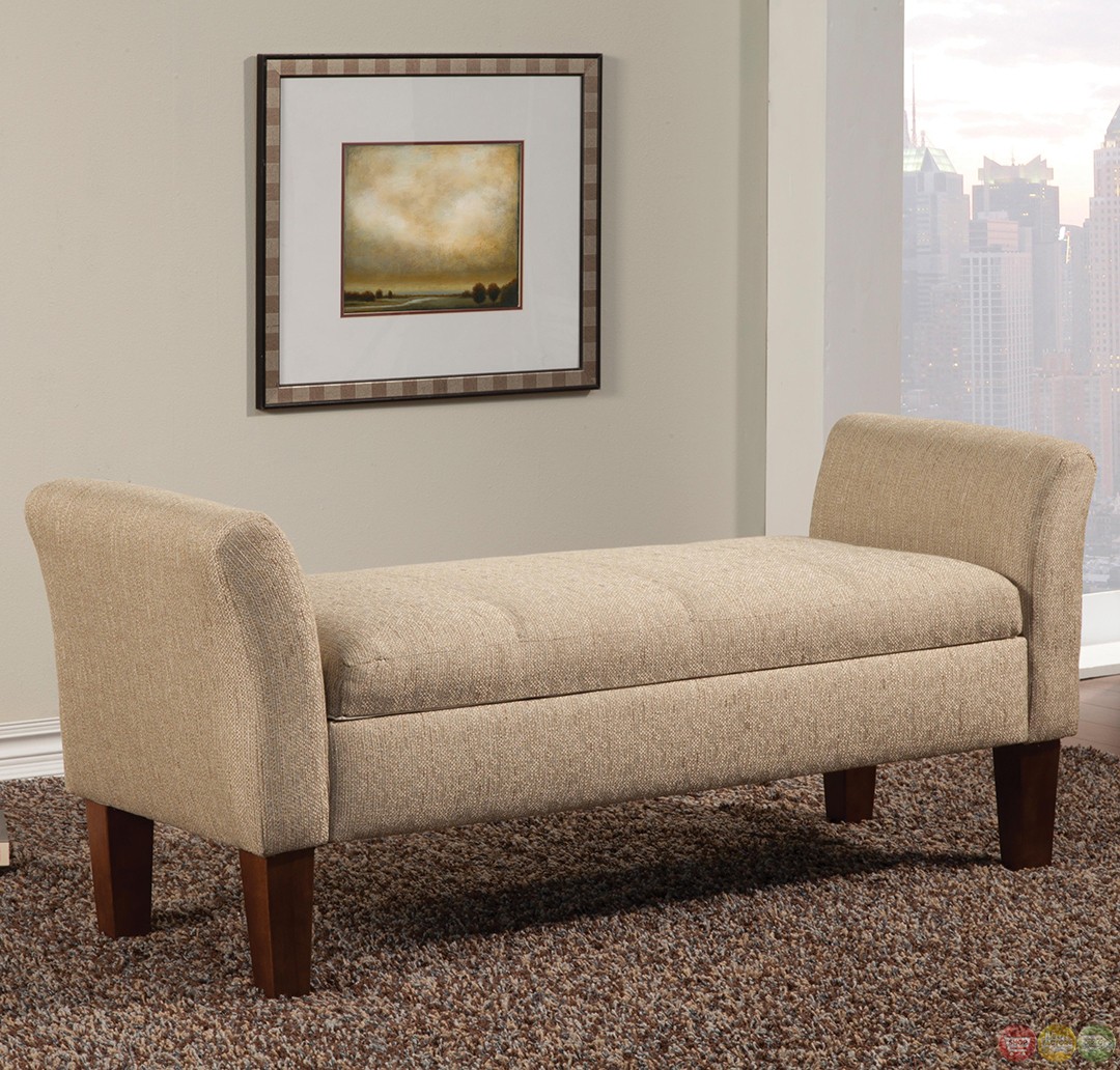 Light tan fabric upholstered storage bench with flared arms