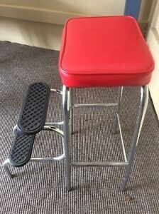 Red padded top two step stool with fold back steps