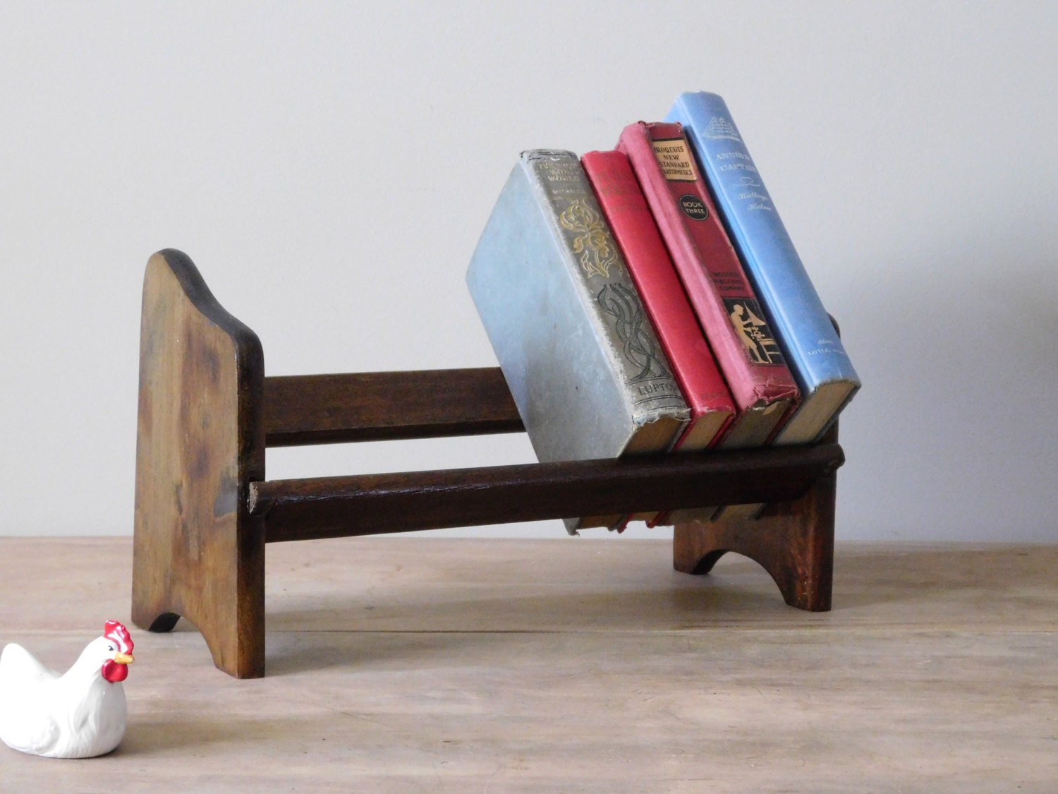 Reserved wooden table top book rack
