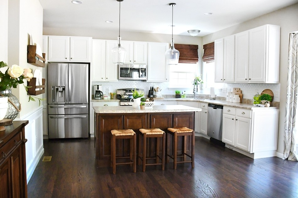 White cabinets dark kitchen island for your home