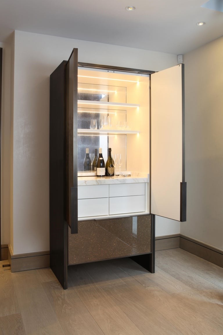 Bespoke cocktail cabinet in bronze with marble shelf and