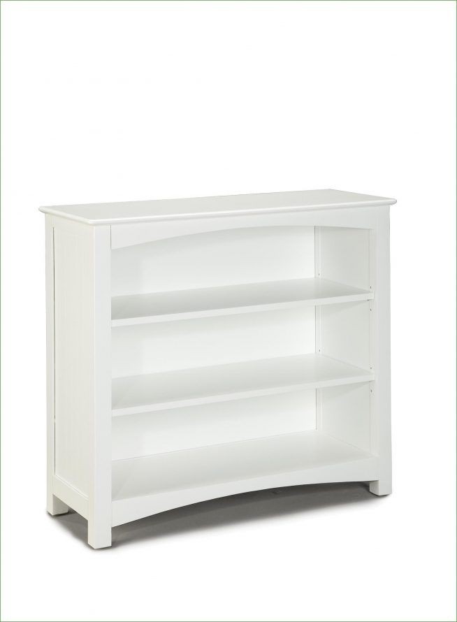 Low white bookcase with doors