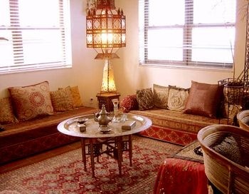 Traditional moroccan living room with low benches and