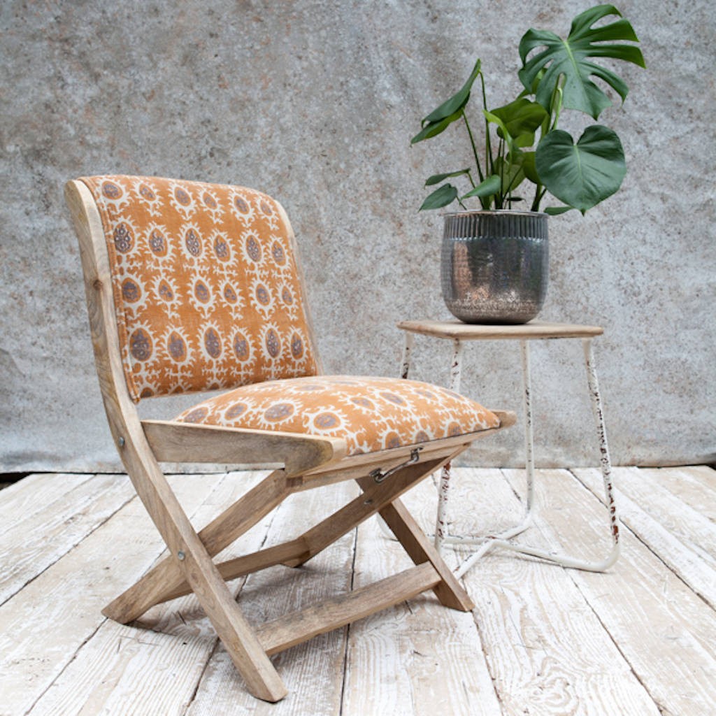 Upholstered folding mango wood chair by the forest co 1