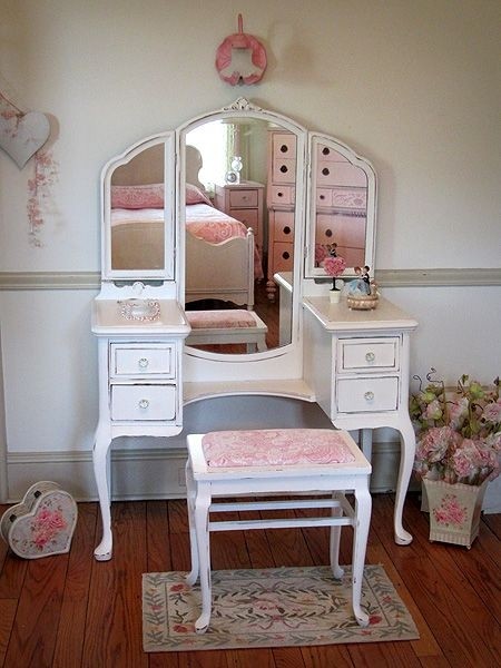 Adorable white vanity with tri fold mirror and bench