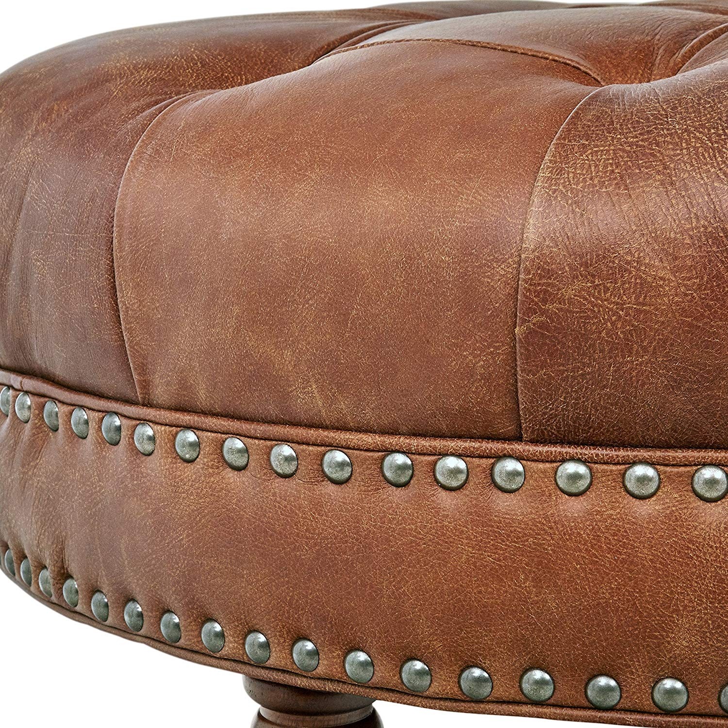Button tufted round leather wheeled ottoman with spindled 1