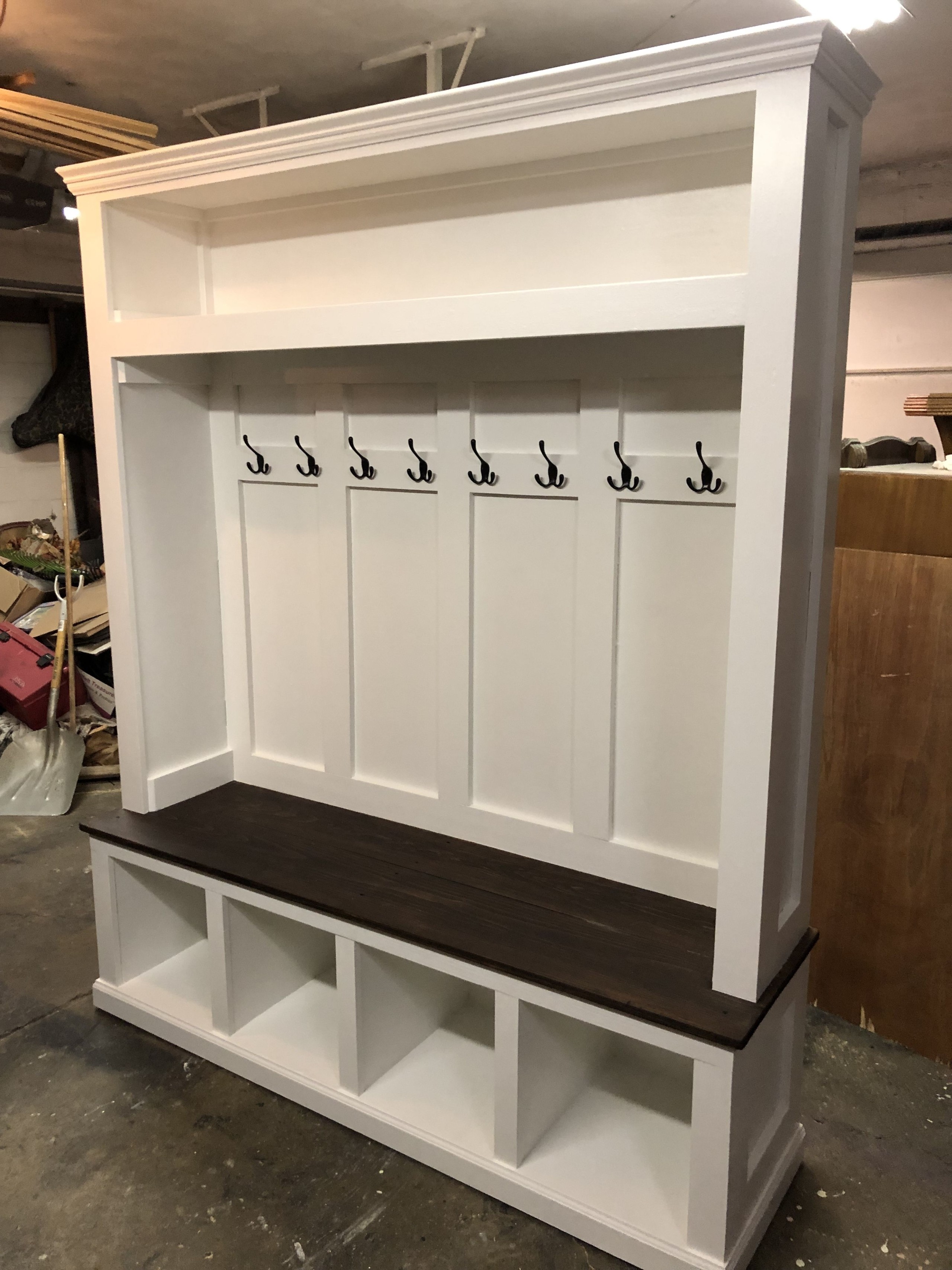 Hand built coat rack bench with storage finished in a